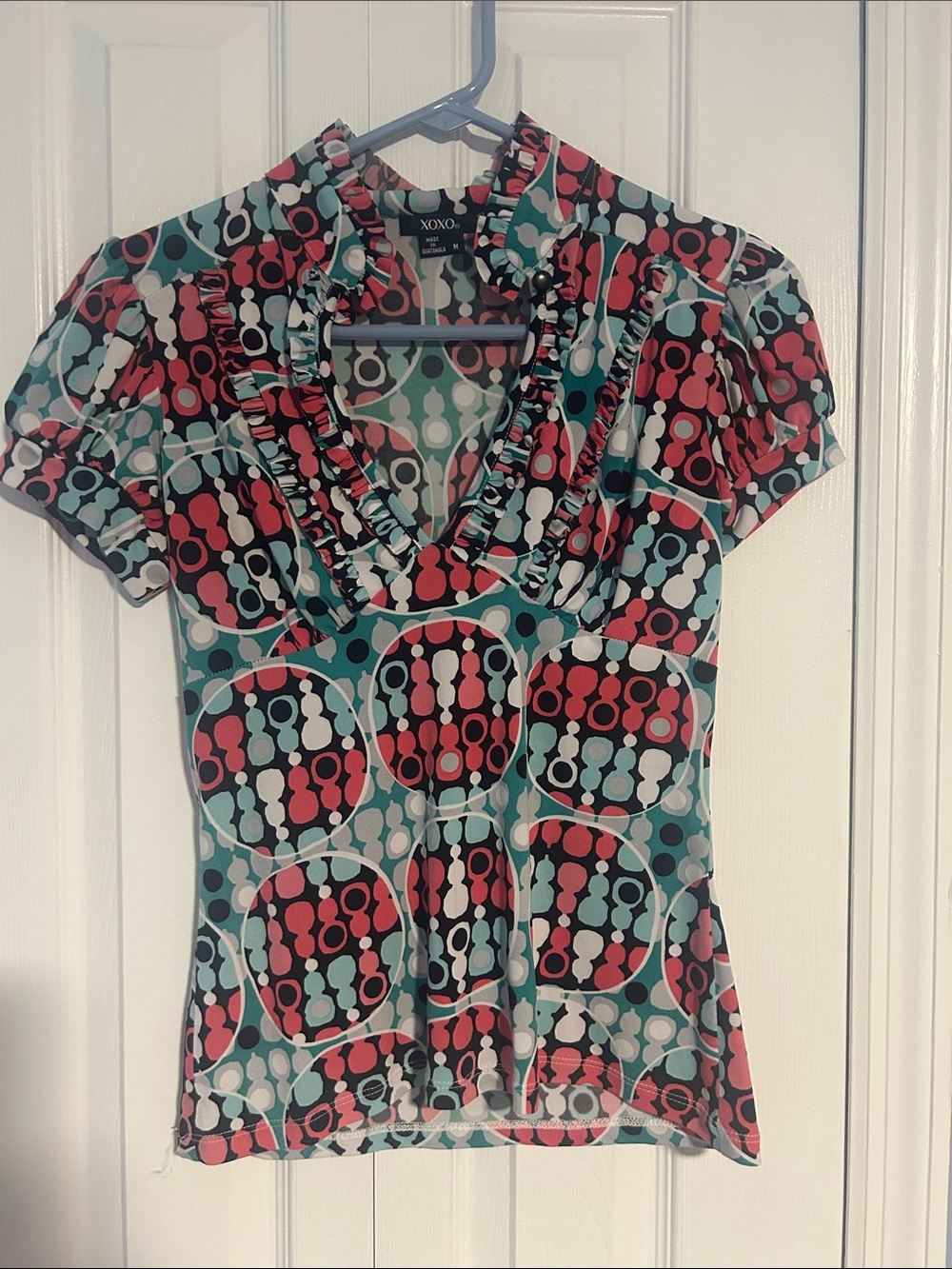 XOXO Teal, Coral & Black Geometric Ruffle V-Neck Blouse